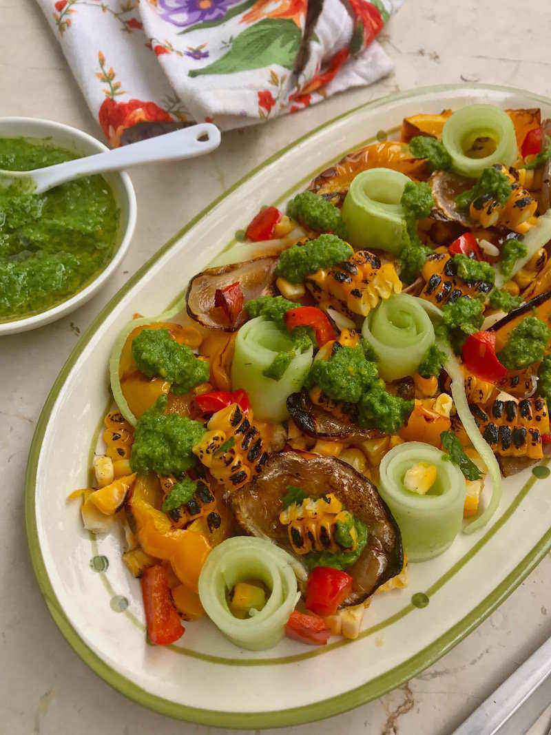Recipe for Corn Cucumber Salad with Chimichurri Sauce, and a bunch of other colourful vegetables, a must try when corn is in season! 